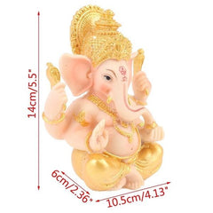 Gouden en roze Ganesha olifant beeldje, een stijlvolle interieurdecoratie die geluk en harmonie brengt.