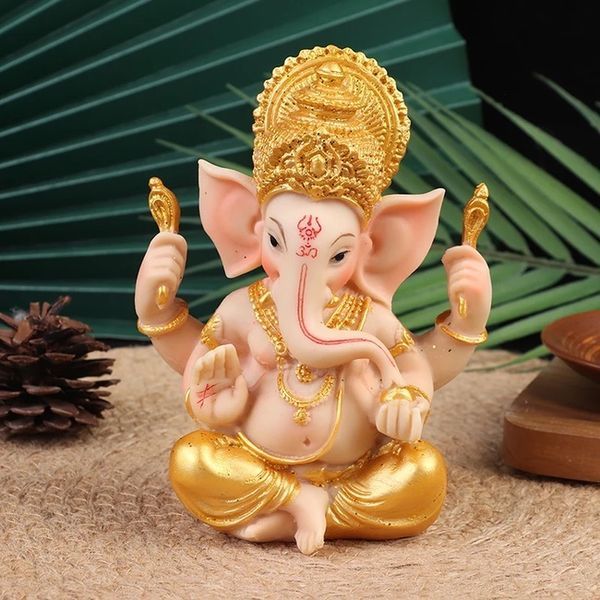 Ganesha olifant beeldje in goud en roze, een elegant symbool van geluk en voorspoed voor je interieur.